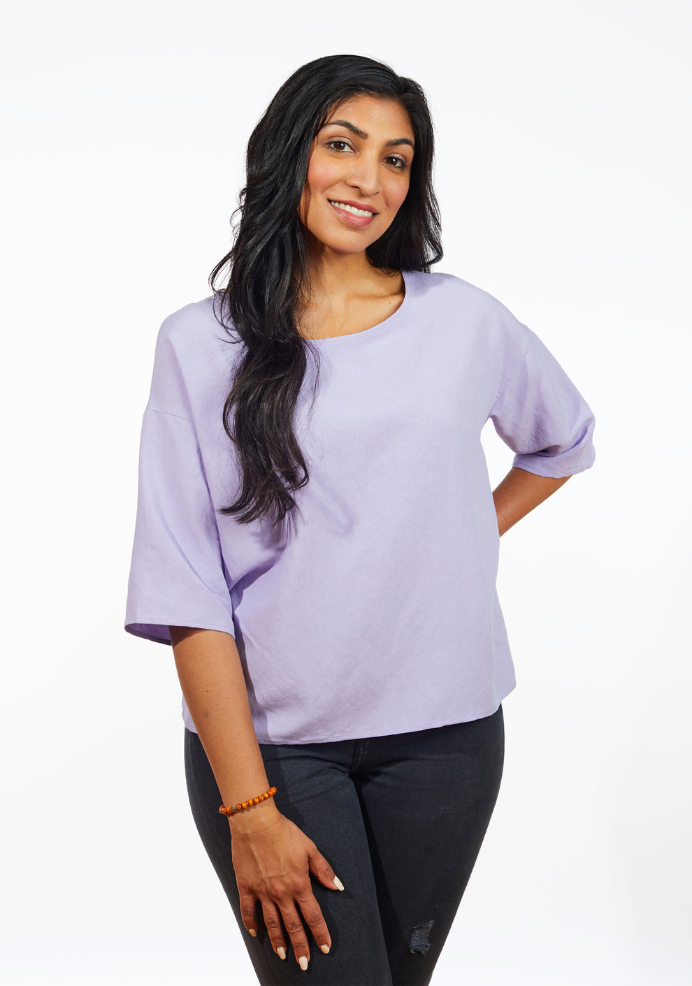 Close-up front view of lilac Corin Top with drop shoulders and round neckline.