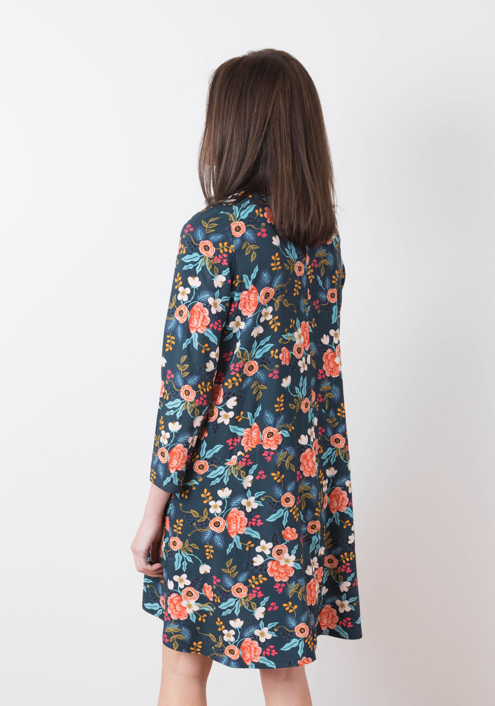 Back view of model wearing floral Farrow Dress with long sleeves, view B.