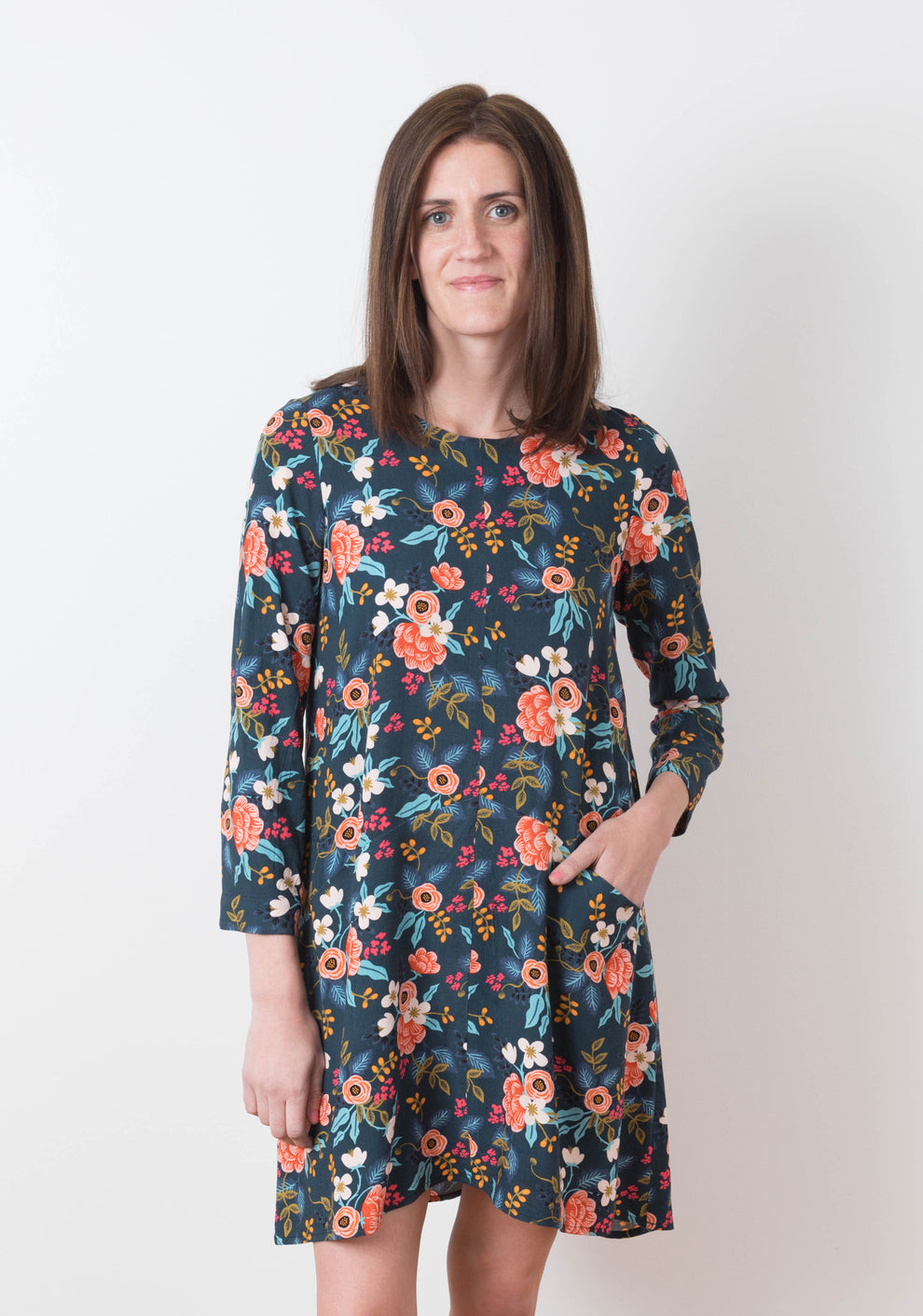 Model: Size 6, 5'8" | Model wearing Farrow Dress in floral fabric with long sleeves and front pockets, view B.