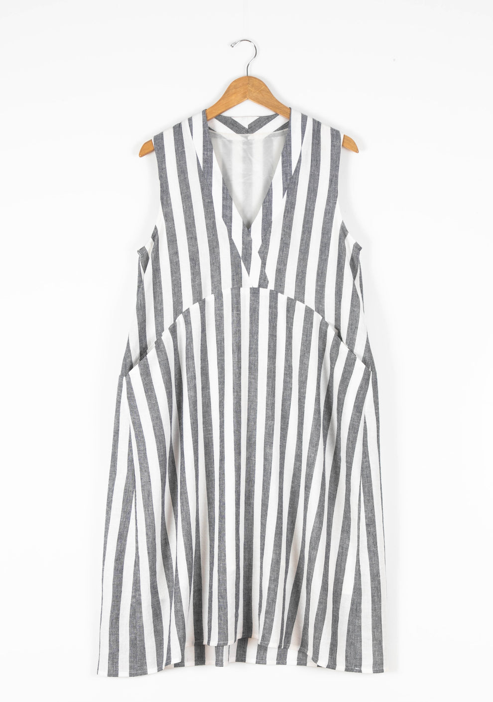 Flatlay of sleeveless Felix Dress in gray and white striped fabric.