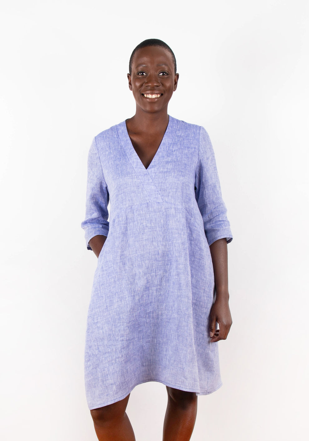 Model wearing Felix Dress in blue linen, front view with 3/4 sleeves.