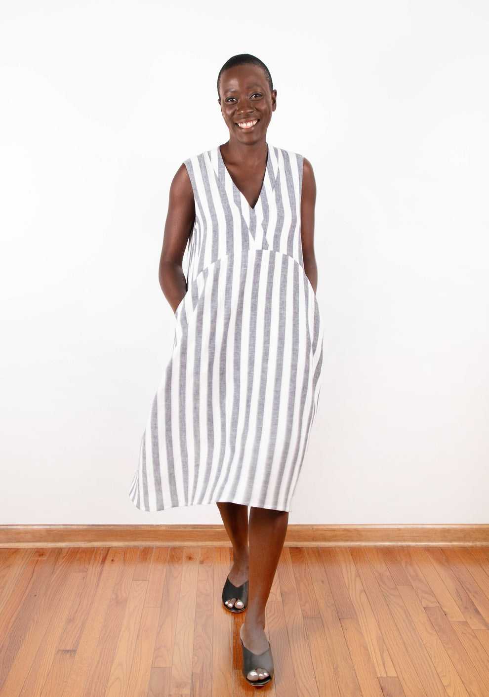 Model: Size 6, 5'6" | Model wearing sleeveless Felix Dress in gray and white striped fabric, front view.