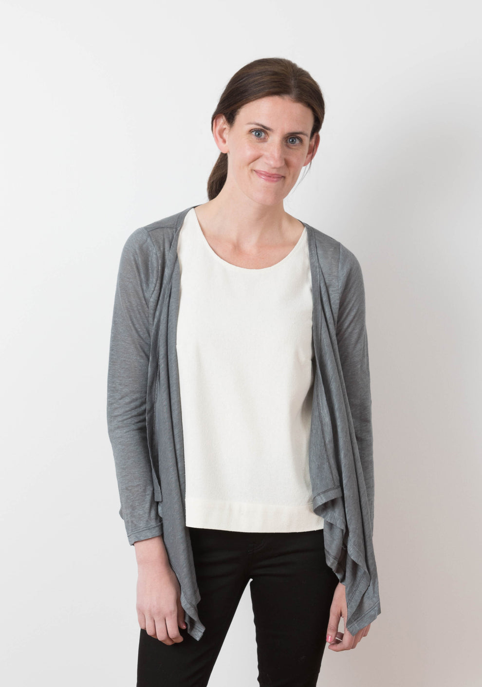 Model: Size 6, 5'8" | Woman wearing the grey Lark Cardigan in a front view, showing waterfall front and long sleeves.