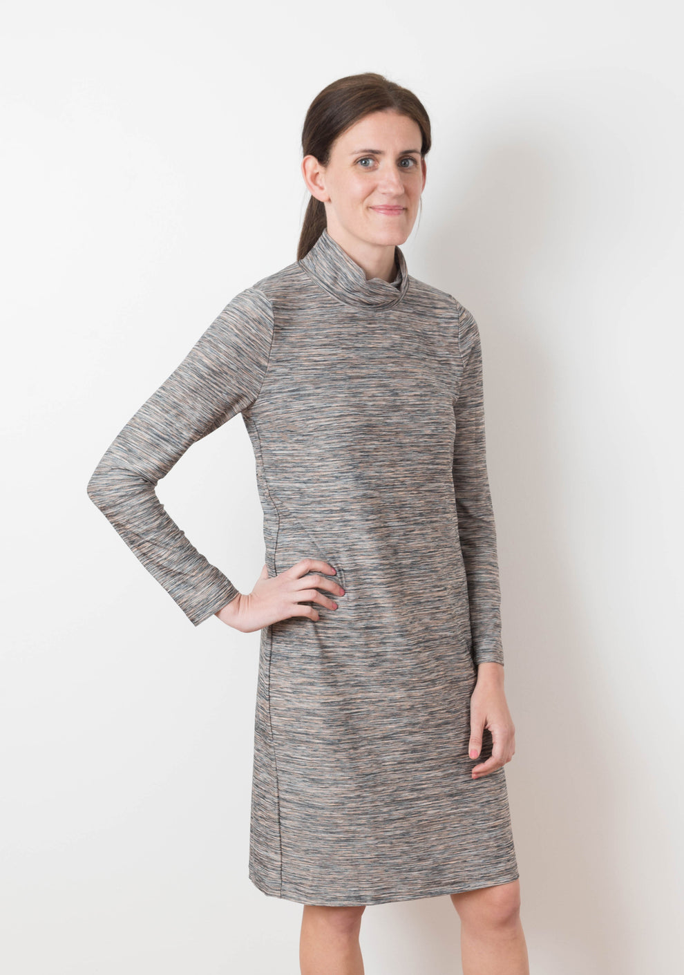 Model in heathered Lark Dress with cowl neck and long sleeves, front view.