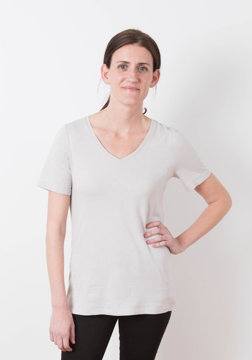 Model wearing Lark Tee with short sleeves and V-neckline, front view.