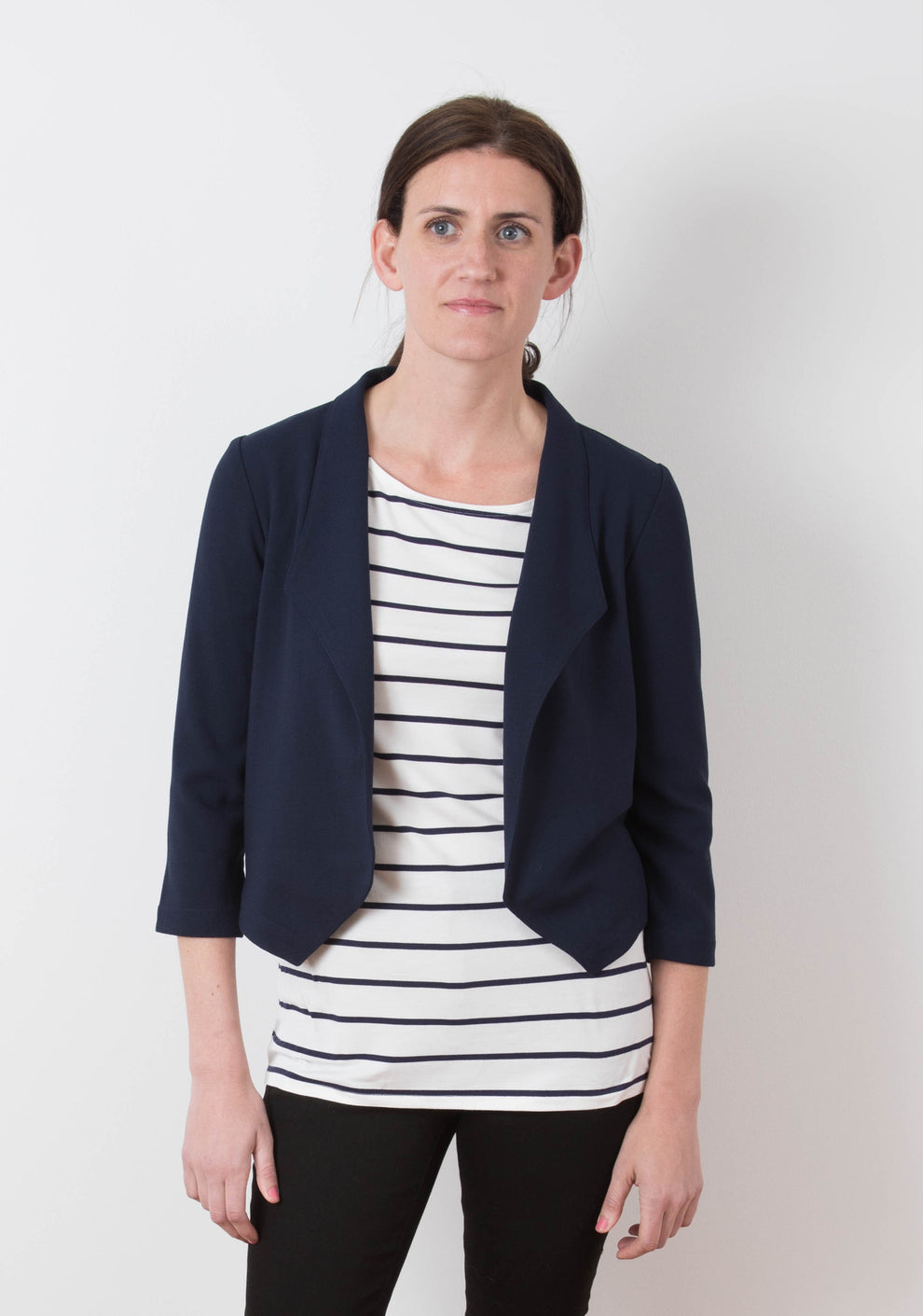 Model: Size 6, 5'8" | Model wearing Morris Blazer in navy stretch woven fabric, front view with striped tee and black pants.