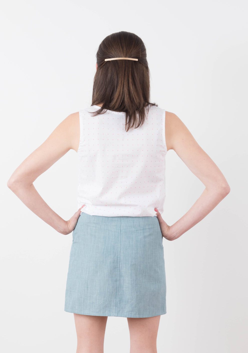 Back view of Moss Skirt in light blue chambray showing center back seam and waistband.