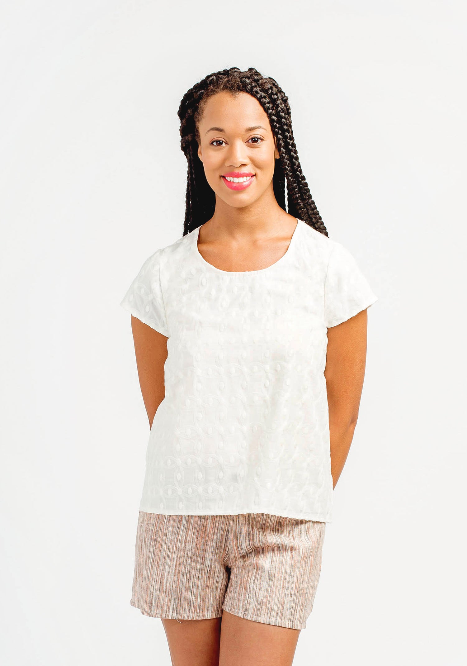 Model: Size 6, 5'8" | Model wearing white embroidered Scout Tee facing front, hands behind back.