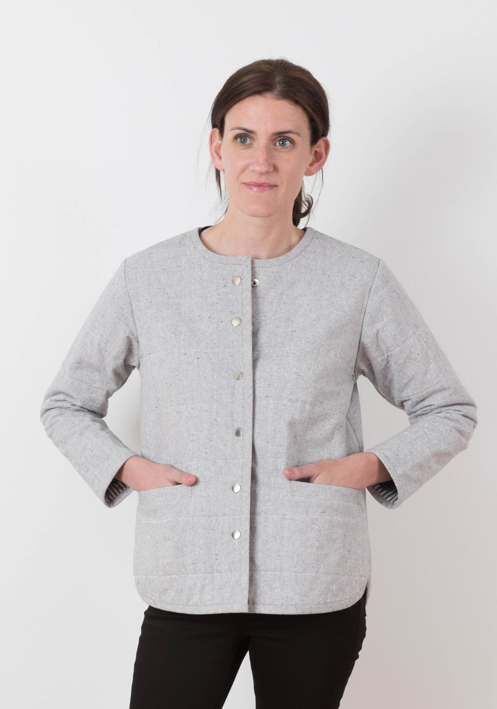Front view of gray quilted Tamarack Jacket in View B with snap closures and patch pockets, worn by model.