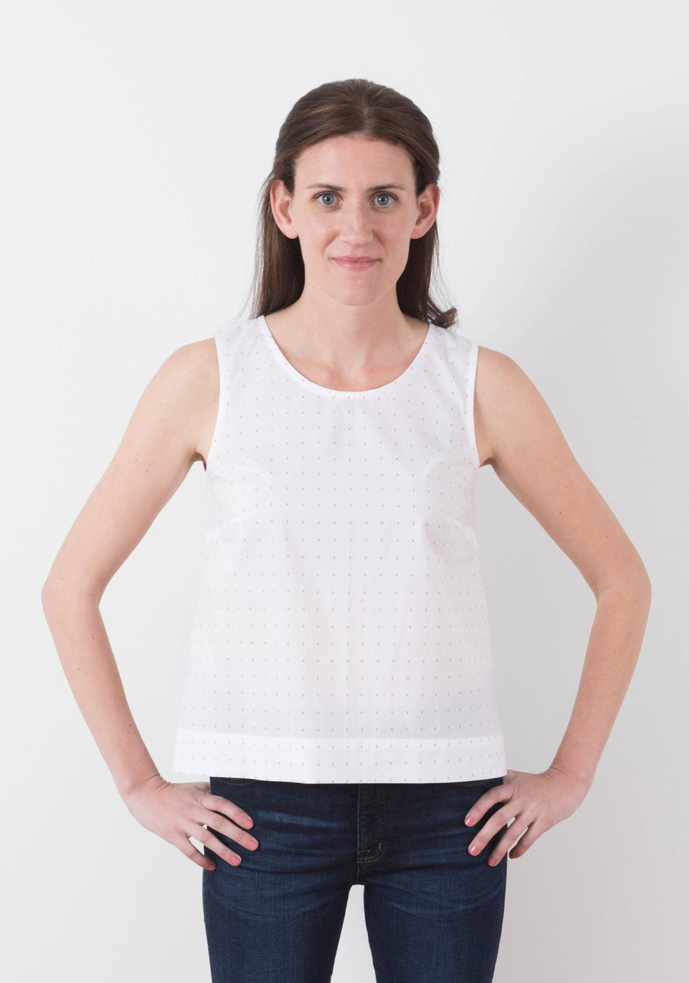 Model: Size 6, 5'8" | Front view of sleeveless Willow Top in white print fabric, View A, worn by model.
